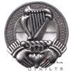 A badge featuring an intricate Celtic knot design alongside a beautifully detailed harp.