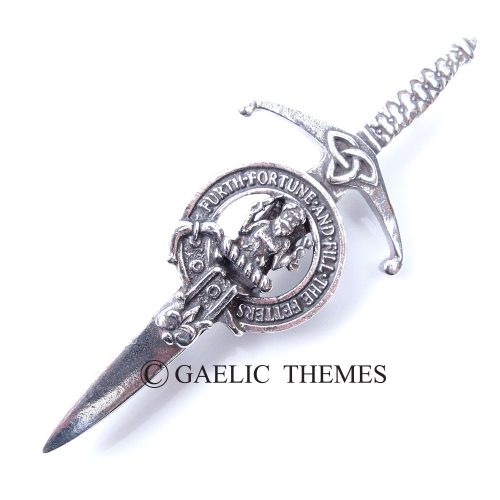 A silver dagger that prominently showcases a Scottish crest, reflecting traditional craftsmanship and heritage in its design.