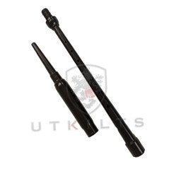 A long black metal tube with a sturdy black handle, ideal for use in musical practice sessions.