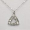 A silver necklace featuring a prominent triangle pendant, elegantly designed and showcased in the image titled Triangular Thistle